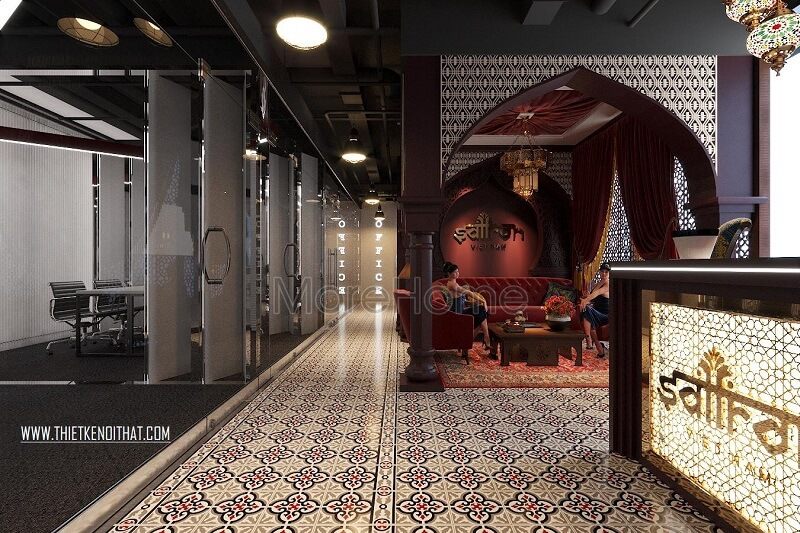 Sảnh chờ lễ tân được thiết kế theo phong cách Ấn Độ hiện đại với bộ sofa nỉ màu đỏ cao cấp, tạo nên một điểm nhấn nổi bật cho văn phòng.